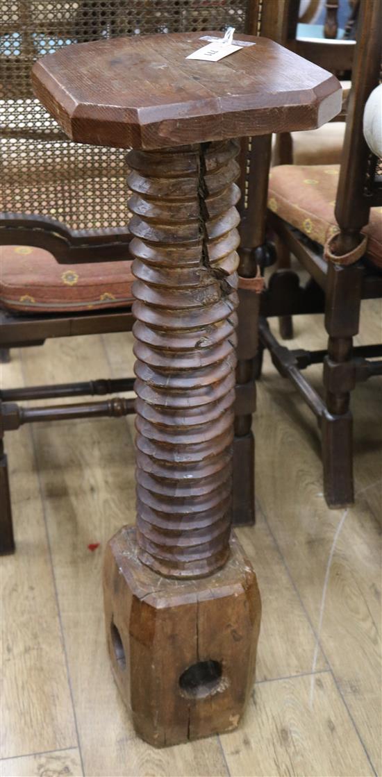 An oak screw-press torchere H.93cm